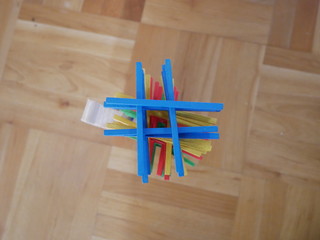 clothes pegs on wooden background