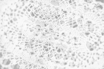 Abstract vintage white background, knitted homemade delicate lace of crochet napkins in retro style, double exposure photo