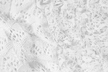 Abstract vintage white background, knitted homemade delicate lace of crochet napkins in retro style, closeup