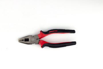 Obraz premium pliers cut the wires to the red sky, placed on a white background.