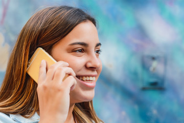 Young woman talking on her mobile phone.