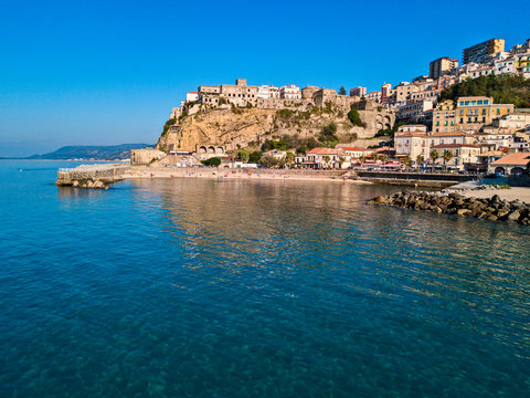 Aerial view of Pizzo Calabro, pier, castle, Calabria, tourism Italy. Panoramic view of the small town of Pizzo Calabro by the sea. Houses on the rock. On the cliff stands the Aragonese castle