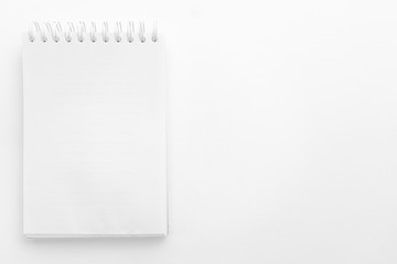 Empty notebook with white texture background surface. Copy space for add text or art work designs.