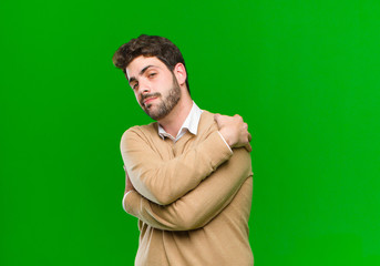 young businessman feeling in love, smiling, cuddling and hugging self, staying single, being...