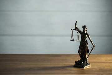 Themis figurine.Weight of justice. The criminal law. Low concept