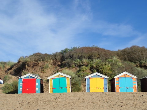 Colourful beach huts at Saunton