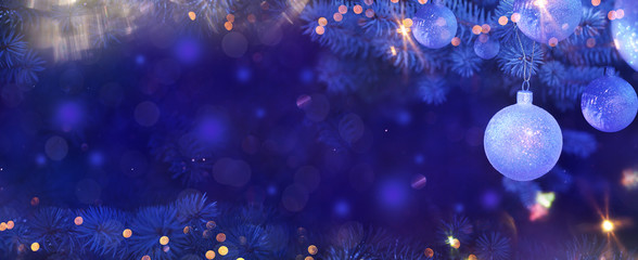 Christmas and New Year holidays background. Glitter lights backdrop. Winter season. Text space. Closeup of Christmas-tree.