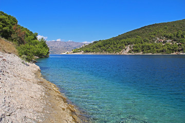 Fototapeta premium Beautiful landscape of sea Coast of Adriatic sea with Transparent Blue Water in Pucisca, Croatia. Island of Brac summertime.