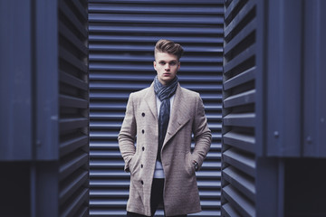 elegant men man in coat and scarf in urban style