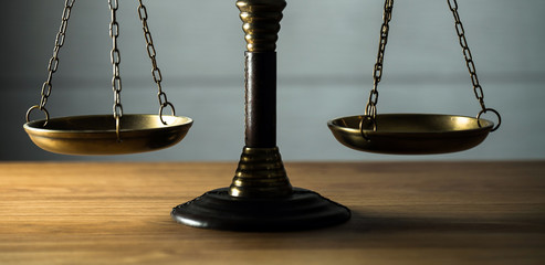 Wooden judge`s gavel.  Themis figurine. The criminal law. Low concept.