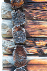 Detail of dovetail on traditional vintage wooden log cabin in Sweden