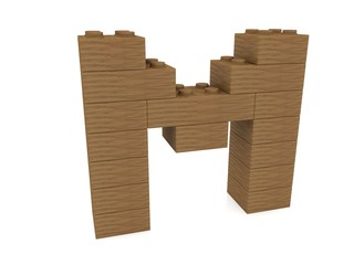 Letter M concept built from toy wood bricks