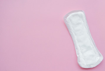 Clean white daily, menstrual woman pad for hygiene or blood period. Menstruation sanitary soft pad, hygiene protection. Conception of Woman's health, gynecological menstruation cycle. Pink background