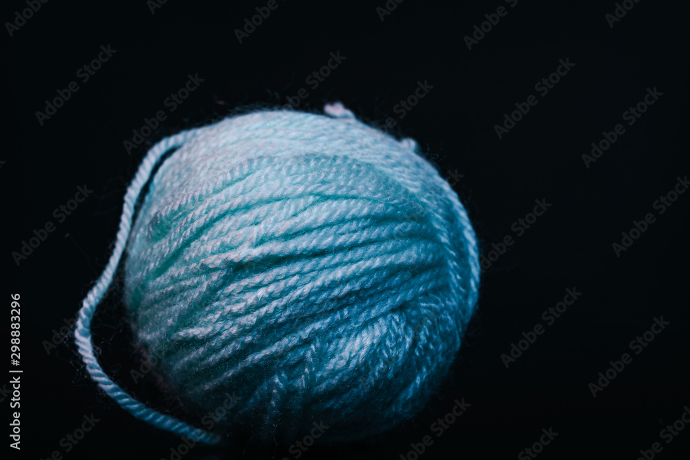 Poster beautiful blue tangle of thread in red and blue light background texture.