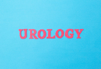 Fototapeta na wymiar Word urology in red letters on a blue background. Sociology of the section of medicine that treats kidney and prostate diseases