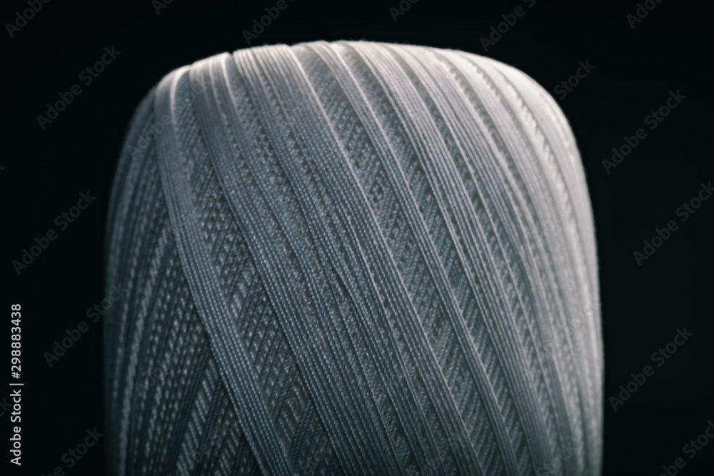 Poster beautiful white tangle of thread on a dark background texture.