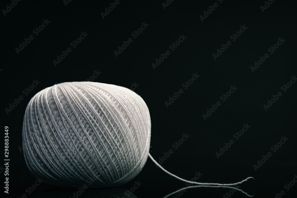 Poster beautiful white tangle of thread on a dark background texture.
