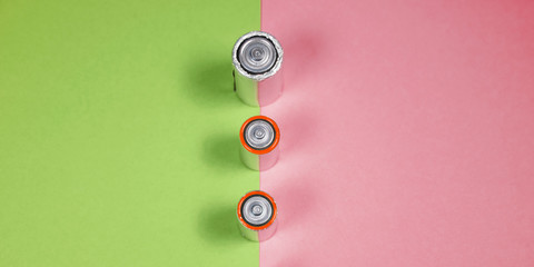 Many different types used or new battery, rechargeable accumulator, alkaline batteries on color...