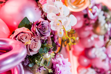 decoration balloons and flowers on pink background