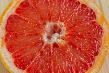 Red flesh of grapefruit close-up. Half of grapefruit, fresh citrus. Texture. Sour ripe juicy fruit