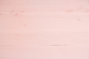 Old grungy wooden planks background in pink color. Abstract background and texture for design