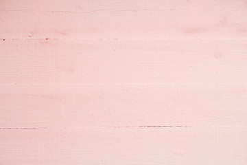 Old grungy wooden planks background in pink color. Abstract background and texture for design
