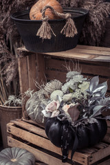 Beautiful autumn street decor with pumpkins and flowers.