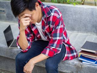 Asian male students were disappointed with the results of the entrance examination for the university. Sadness and upset
