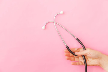 Simply minimal design woman hand holding medicine equipment stethoscope or phonendoscope isolated...