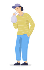 Young man huffing a bag with narcotic substances. Idea of drug addiction