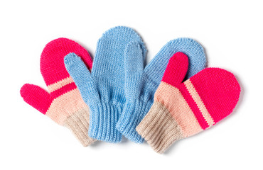 Colored knitted baby mittens isolated on a white background, top view. Winter clothes.