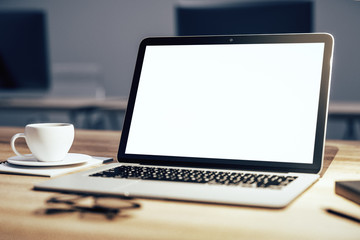 Closeup of white laptop on desktop