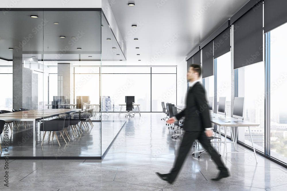 Sticker businessman in clean concrete office interior