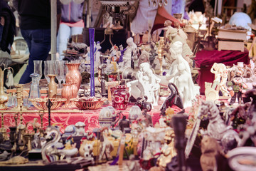Flea market with vintage objects. Furniture for sale (selective focus)