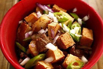 Fried tofu and pork with soy sauce in a bowl