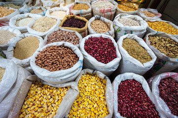 Different kinds of healty grains, legumes and beans in bulk bags at the market in Ibarra, Ecuador, South America. Organic healthy fresh vegan food.