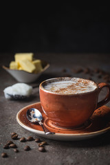 Bulletproof coffee, blended with organic butter and MCT coconut oil, paleo, keto, ketogenic drink breakfast.