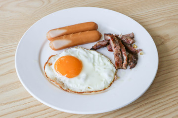 Breakfast: fried egg, sausage, grilled pork