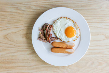 Breakfast: fried egg, sausage, grilled pork