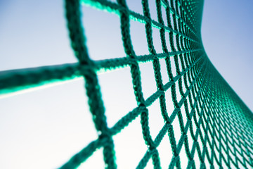 Net on the stadium against the blue sky.