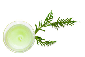 Christmas decoration - candle and spruce branches isolated on white background