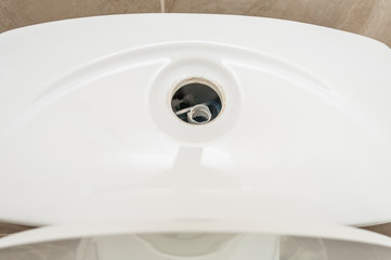Toilet bowl lid without flush button. Broken toilet flush valve.