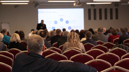 Blur of business Conference and Presentation in the blurred background of event concert lighting at conference hall.