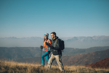 Fototapeta na wymiar Couple hikers on a mountaintop