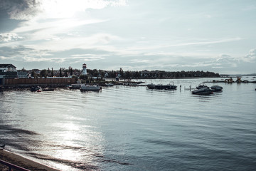 Fototapeta premium sylvan lake, Canada, 22 july, 2019 / View of the lake and the boat harbour at sunset.