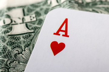 Ace of hearts, playing card and dollar.