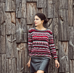 Fototapeta premium Woman posing in a warm knitted handmade sweater