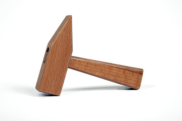 Wooden hammer kids toy isolated on white ground-