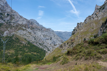 Fototapeta na wymiar Source Route in the peaks of Europe with cliffs and sunny day