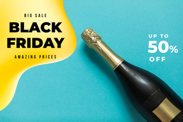 Champagne bottle on blue background. Flat lay. Party celebration concept